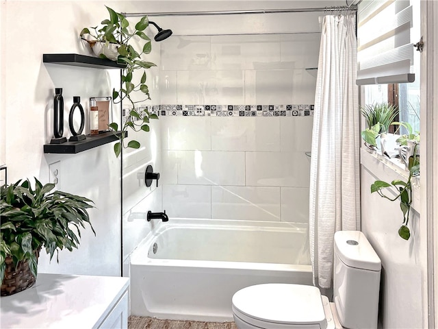 full bathroom with toilet, shower / bath combination with curtain, and vanity