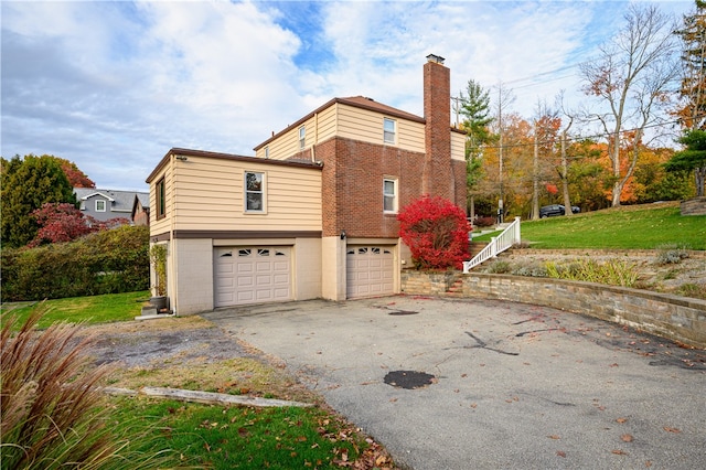 view of property exterior with a garage