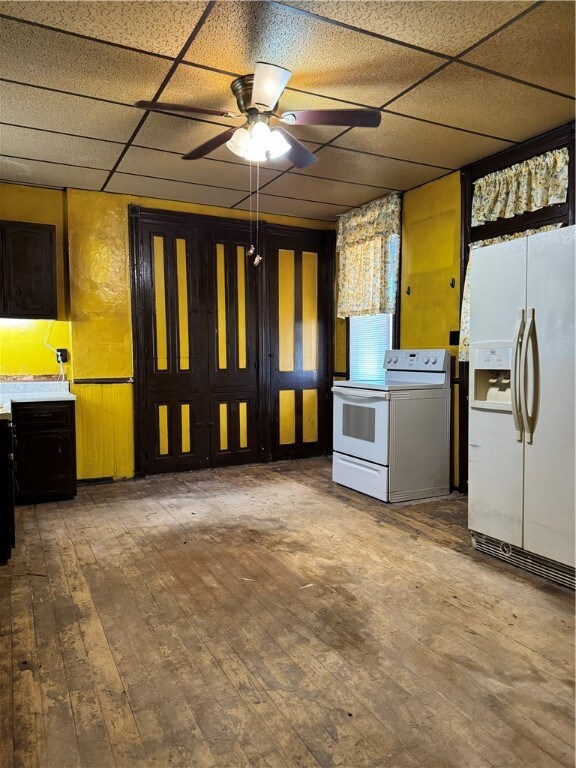 kitchen with a paneled ceiling, ceiling fan, wood-type flooring, and white appliances