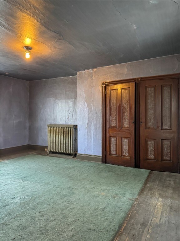 empty room featuring hardwood / wood-style flooring