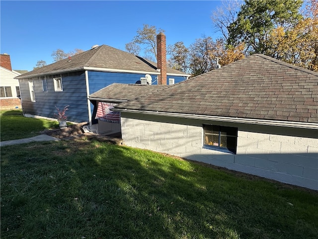 view of property exterior with a yard