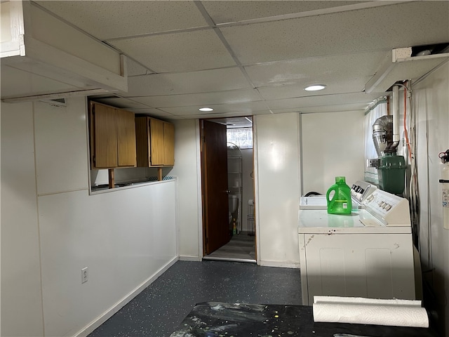 laundry area with cabinets and separate washer and dryer