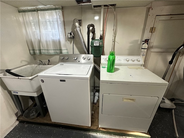 laundry area with sink and washing machine and dryer