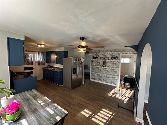 interior space with sink, dark wood-type flooring, and ceiling fan