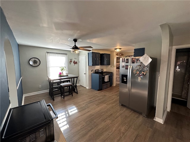 kitchen featuring black range with electric stovetop, ceiling fan, dark wood-type flooring, stainless steel refrigerator with ice dispenser, and blue cabinets