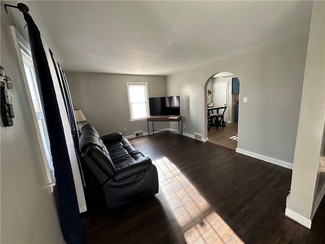 living room with dark hardwood / wood-style floors