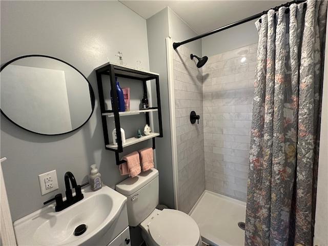 bathroom featuring toilet, curtained shower, and vanity