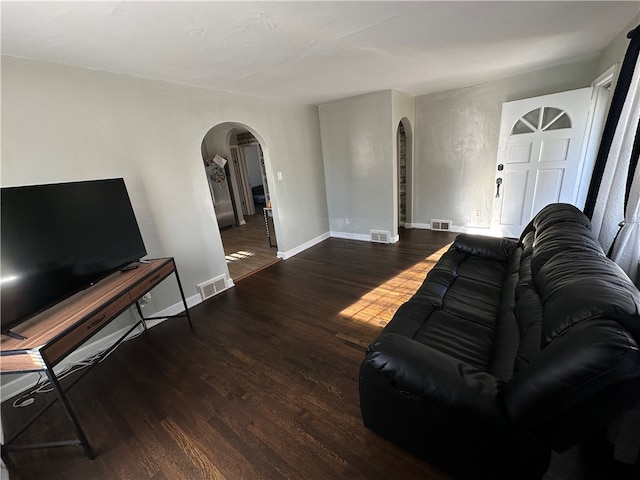 living room with dark hardwood / wood-style floors