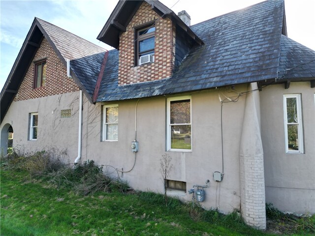 view of property exterior with cooling unit