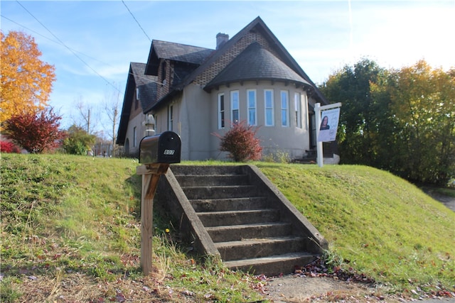 view of home's exterior with a lawn