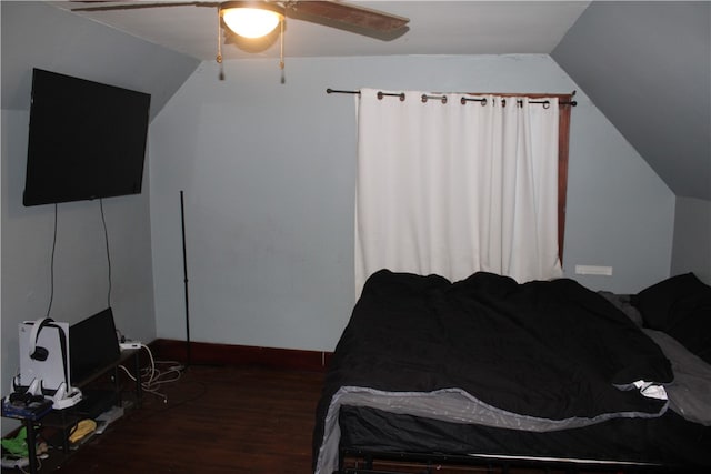 bedroom with vaulted ceiling, dark hardwood / wood-style floors, and ceiling fan