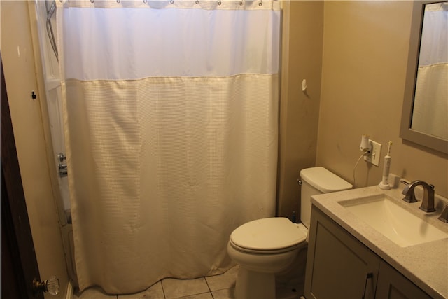 bathroom with vanity, toilet, tile patterned floors, and a shower with shower curtain