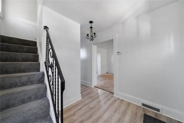 531 Conrad St N, Charleroi, PA 15022 - stairs featuring wood finished floors and a chandelier