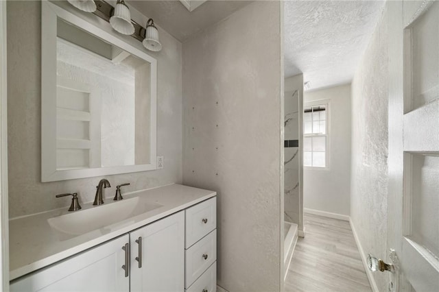 531 Conrad St N, Charleroi, PA 15022 - full bathroom featuring vanity, wood finished floors, a shower, and a textured ceiling