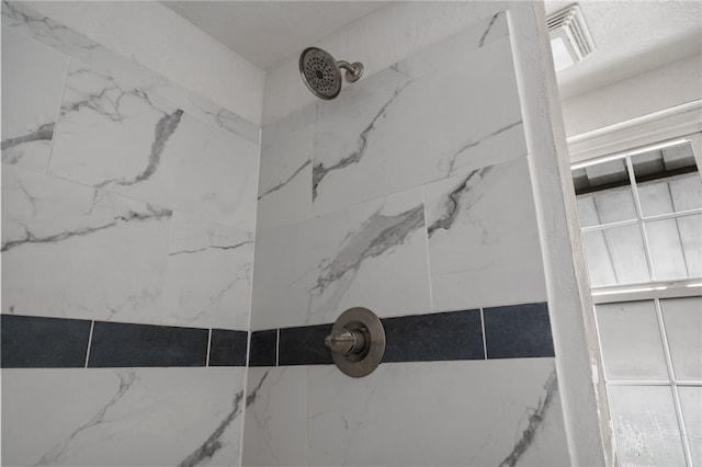 details with a tile shower