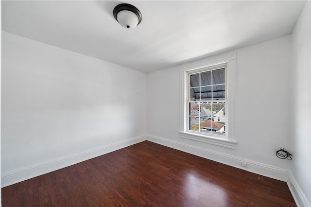 unfurnished room featuring hardwood / wood-style flooring