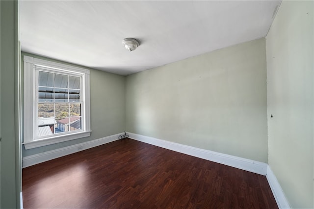 unfurnished room featuring dark hardwood / wood-style flooring