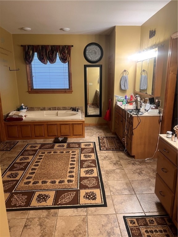 bathroom with vanity and a bath