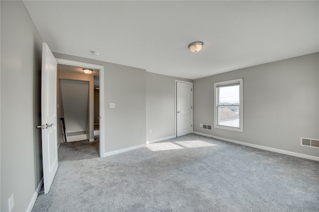 unfurnished bedroom featuring light carpet