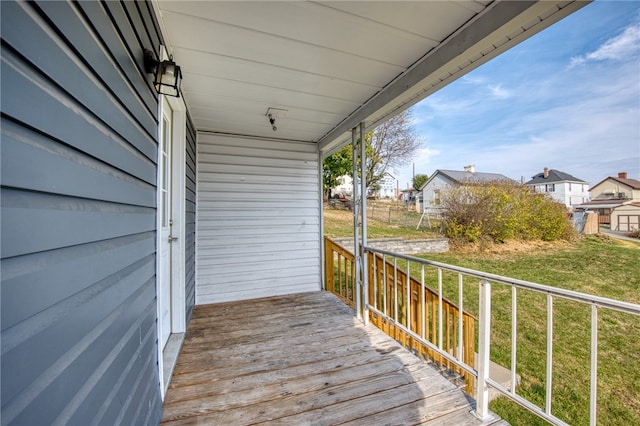 wooden deck featuring a yard