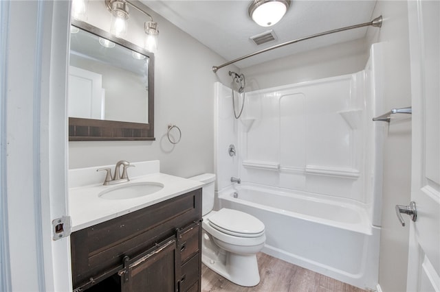 full bathroom featuring vanity, toilet, bathing tub / shower combination, and wood-type flooring