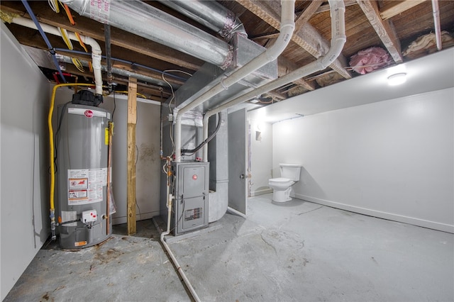 basement featuring heating unit and water heater