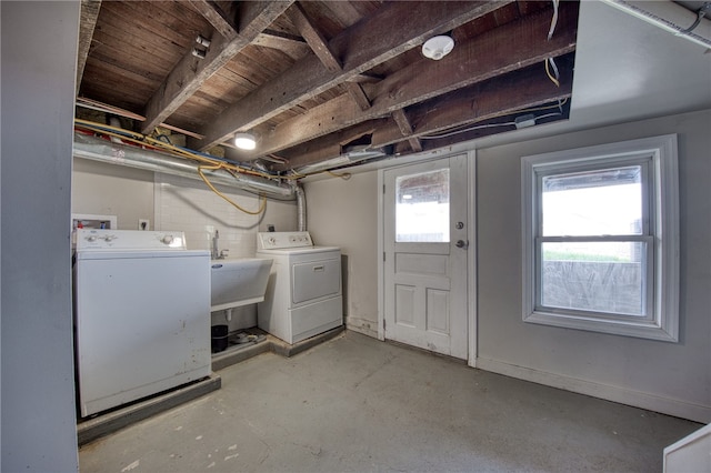 washroom with sink and washer and clothes dryer