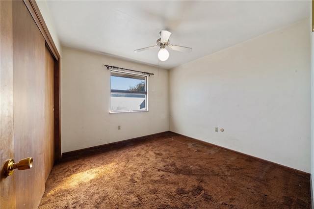 unfurnished bedroom with carpet, a closet, and ceiling fan