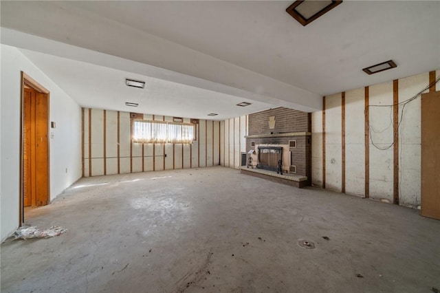26 Petrak St, Fallowfield, PA 15022 - unfurnished living room featuring a brick fireplace and unfinished concrete floors