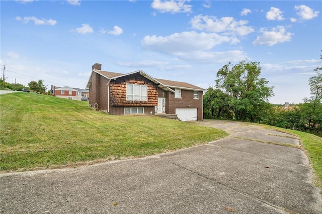 26 Petrak St, Fallowfield, PA 15022 - view of home's exterior with driveway, a chimney, a garage, a yard, and brick siding
