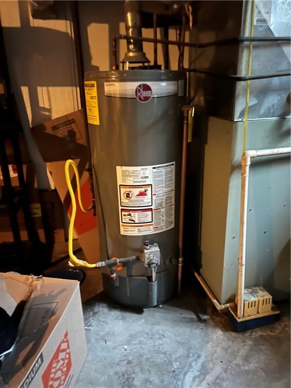 utility room featuring gas water heater