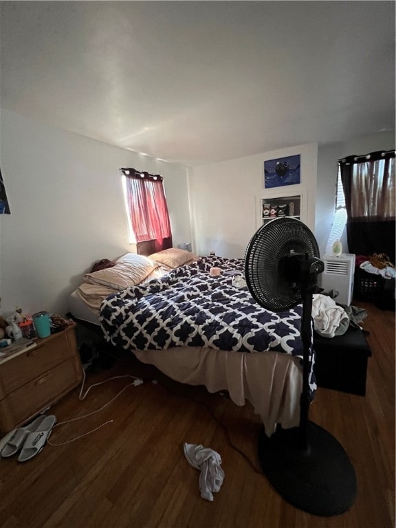 bedroom with wood-type flooring