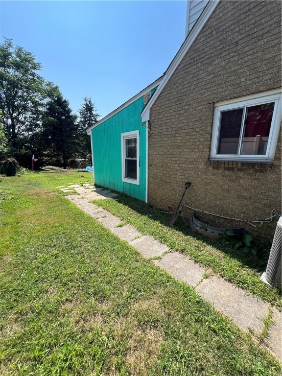 view of yard with central air condition unit