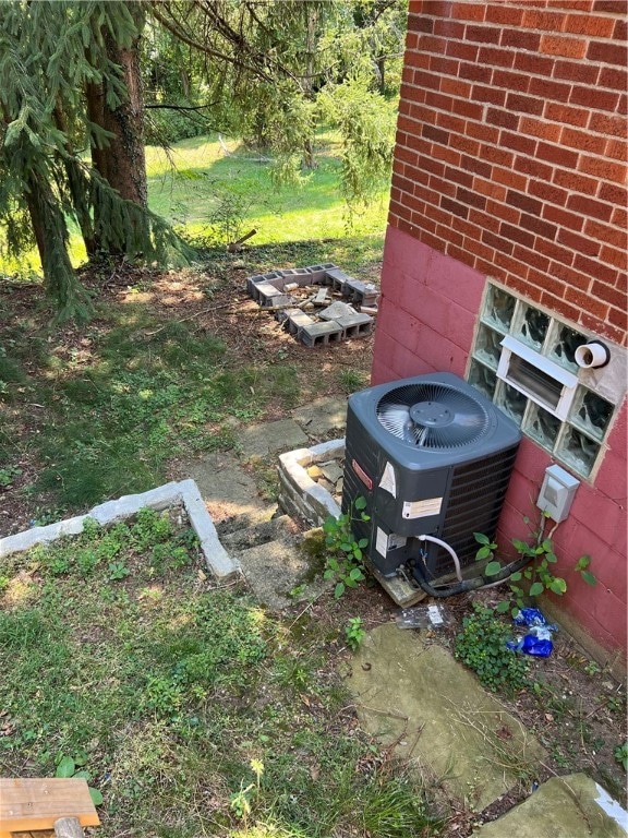 view of yard featuring central air condition unit