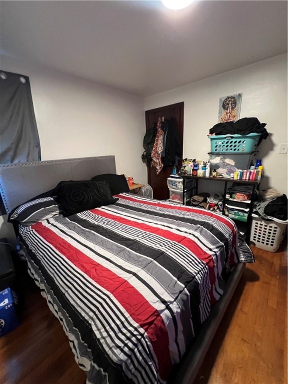 bedroom with wood-type flooring