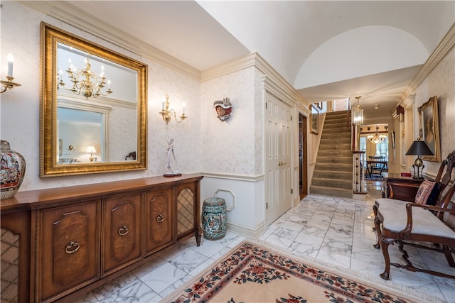 interior space featuring ornamental molding and lofted ceiling