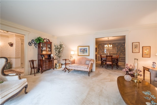 living room featuring ornamental molding, carpet, and a chandelier