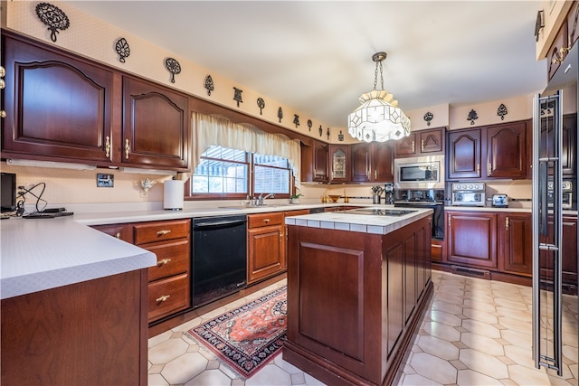 kitchen with black appliances, sink, a kitchen island, pendant lighting, and light tile patterned floors