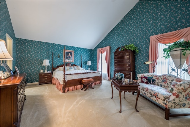 bedroom with carpet flooring and lofted ceiling