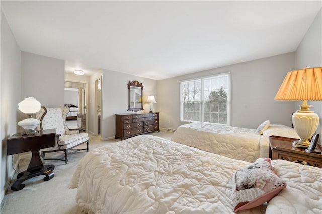 bedroom with light carpet and baseboards