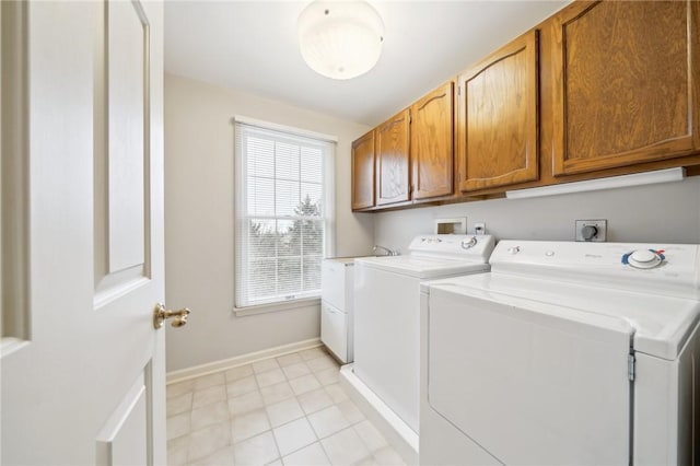 clothes washing area featuring cabinet space, light tile patterned floors, baseboards, and washer and dryer