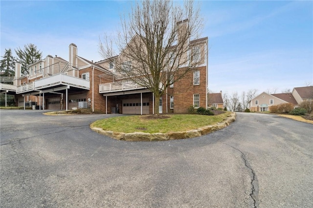 view of property with driveway