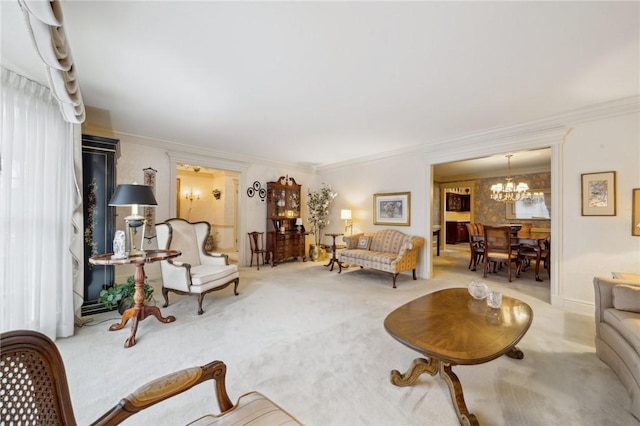 living area with ornamental molding, carpet flooring, and a notable chandelier