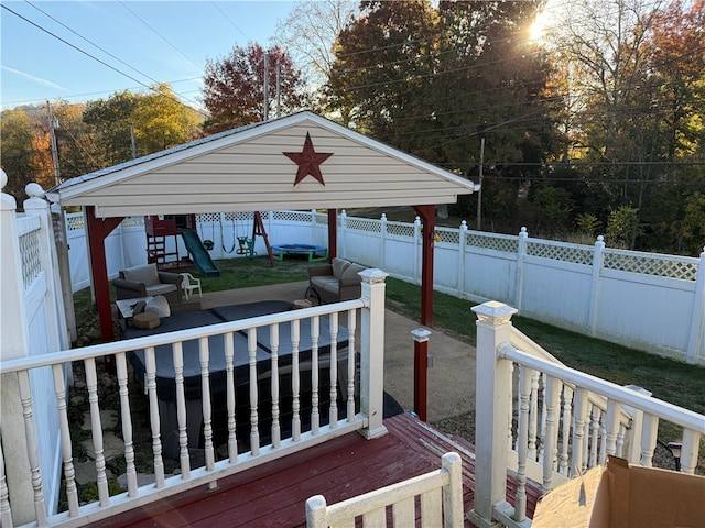 wooden terrace with a lawn