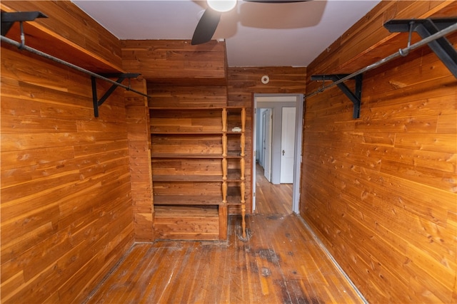 spacious closet with ceiling fan and wood-type flooring