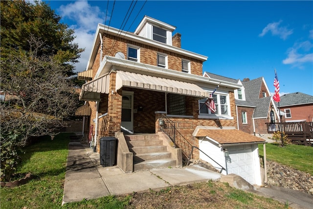 view of front of house featuring a front lawn and a garage