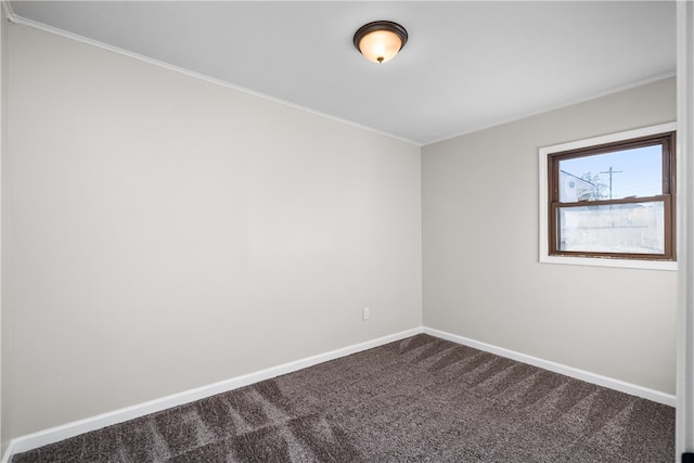 carpeted spare room with crown molding