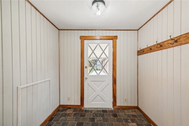 doorway to outside featuring wooden walls