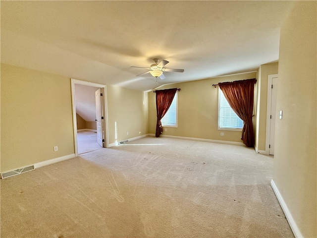 carpeted spare room with ceiling fan