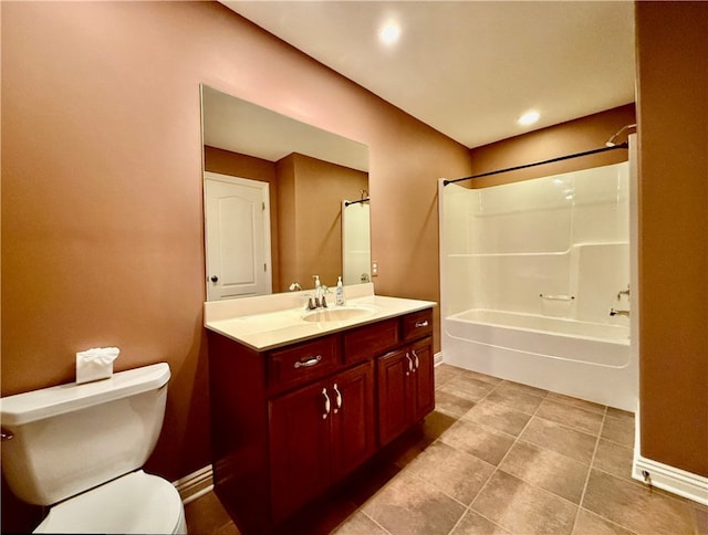 full bathroom with vanity, toilet, tile patterned floors, and washtub / shower combination